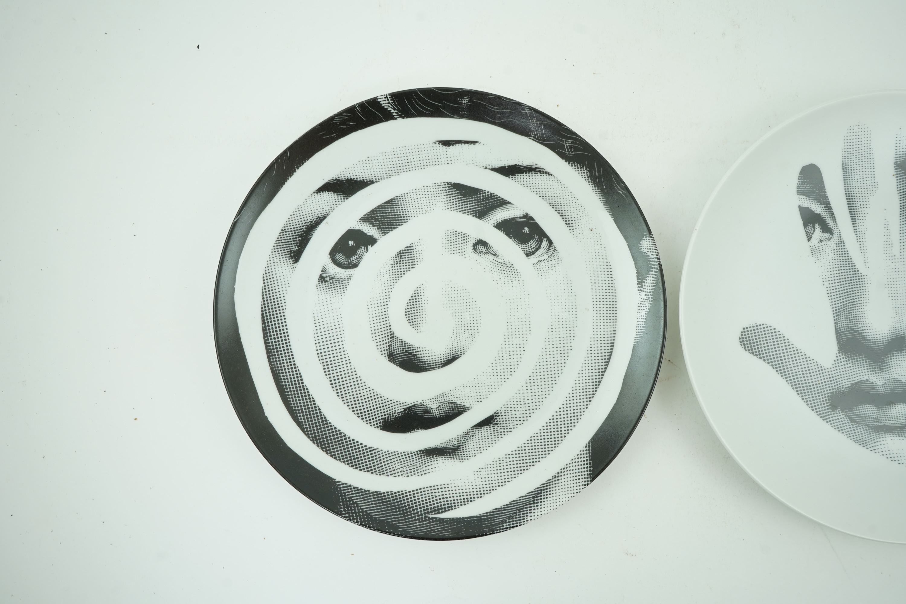 Piero Fornasetti (Italian, 1913-1988): Two 'Tema a Variazioni' plates